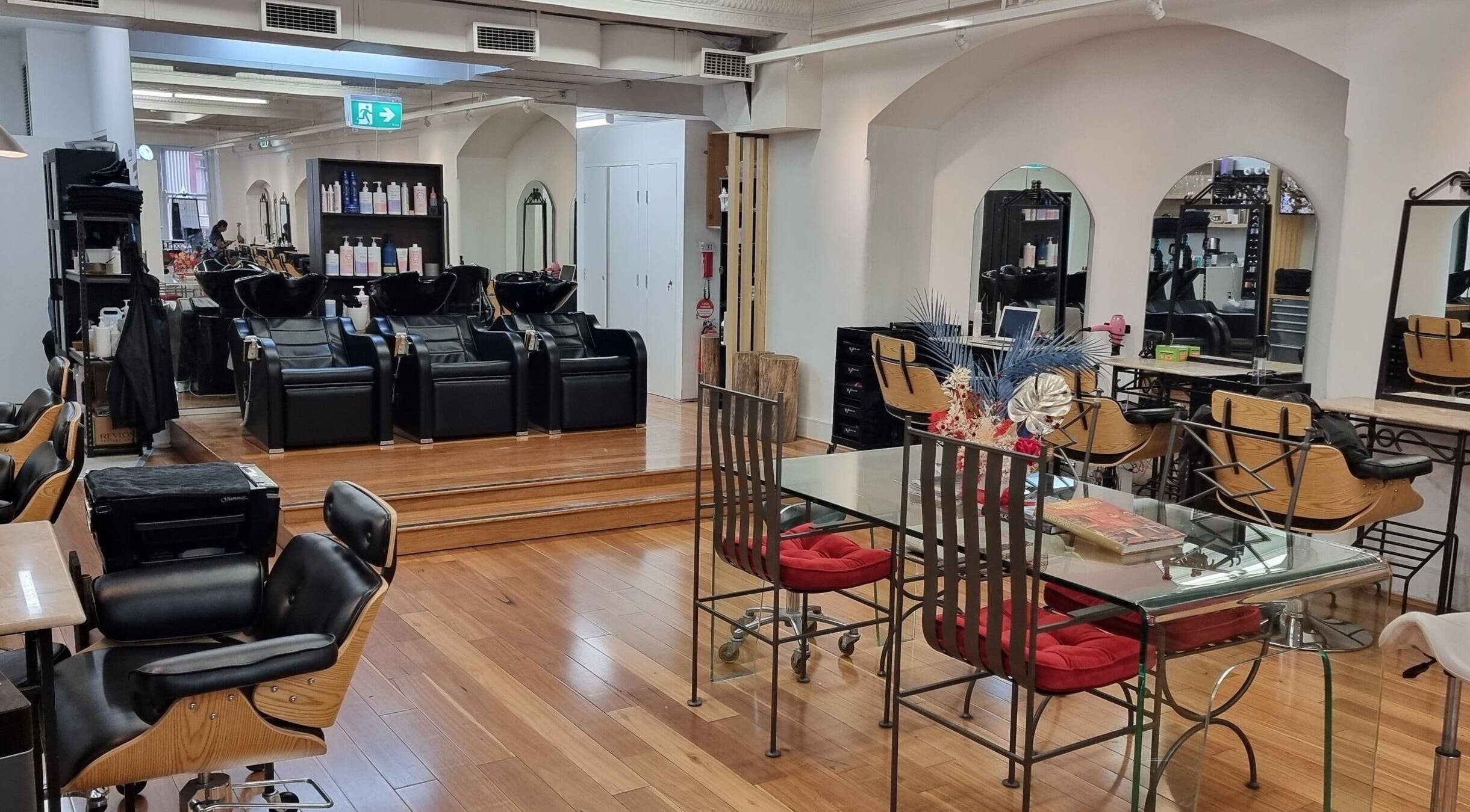 Luxurious salon interior at L'Etoile Elite, Sydney, New South Wales, AU with stylish chairs and modern décor.