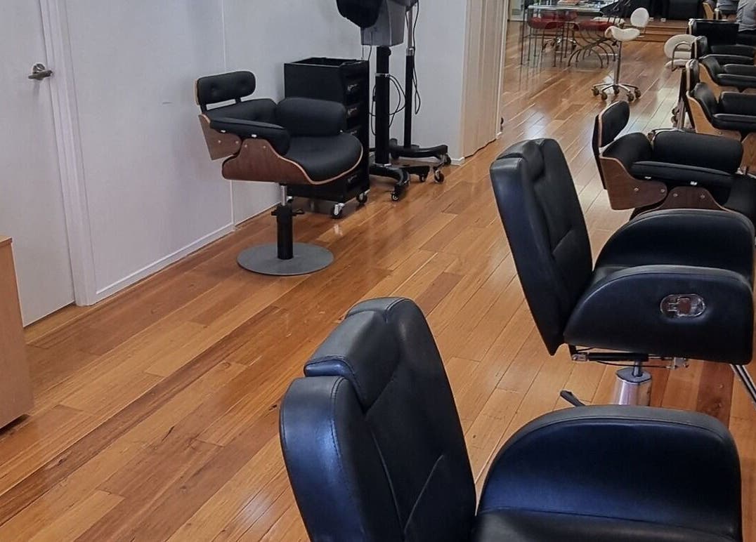 Elegant black salon chairs at L'Etoile Elite, Sydney, New South Wales, AU, showcasing modern beauty ambiance.