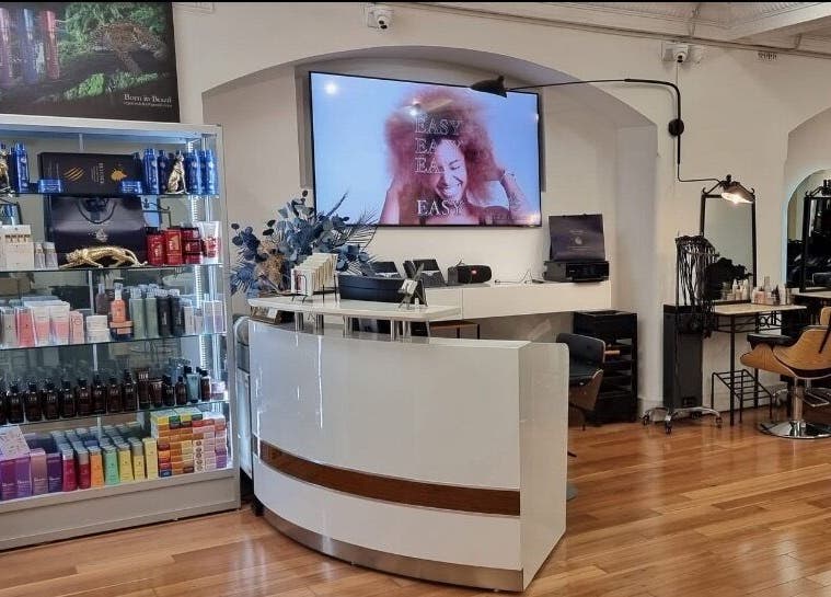 L'Etoile Elite reception area showcasing beauty products in Sydney, New South Wales, AU. Modern and inviting.