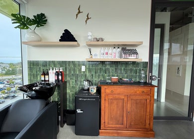 Stylish interior of Summer House Hair Studio in Surrey, British Columbia, CA with chic decor and city view.