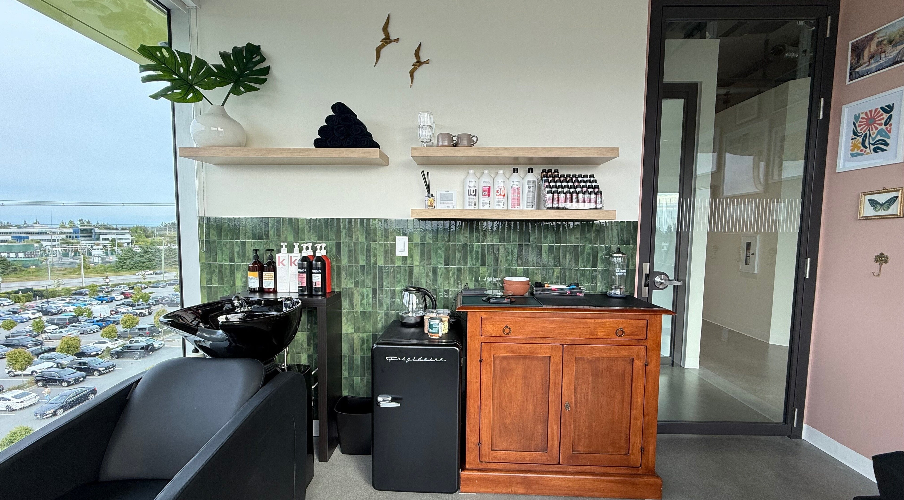 Stylish interior of Summer House Hair Studio in Surrey, British Columbia, CA with chic decor and city view.
