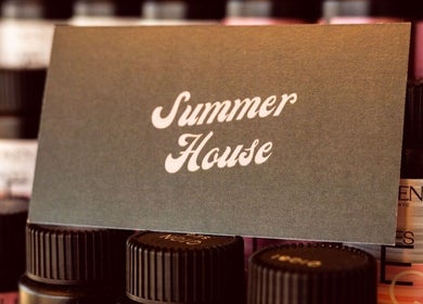 Summer House Hair Studio signage amidst hair products in Surrey, British Columbia, CA.