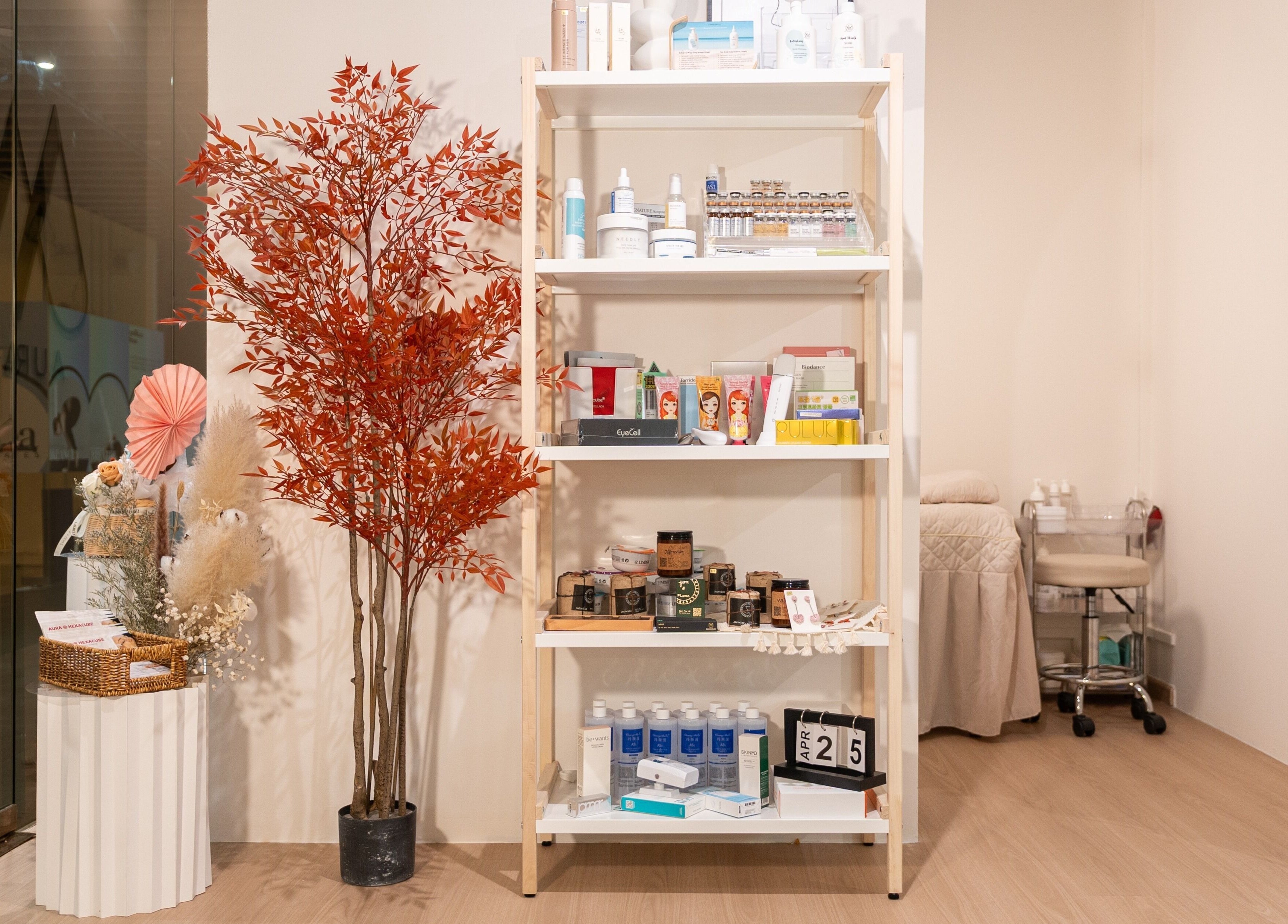 Shelves in AURA Hexacube Studio with beauty products, Singapore, Singapore, SG. Elegant décor and wellness ambiance.
