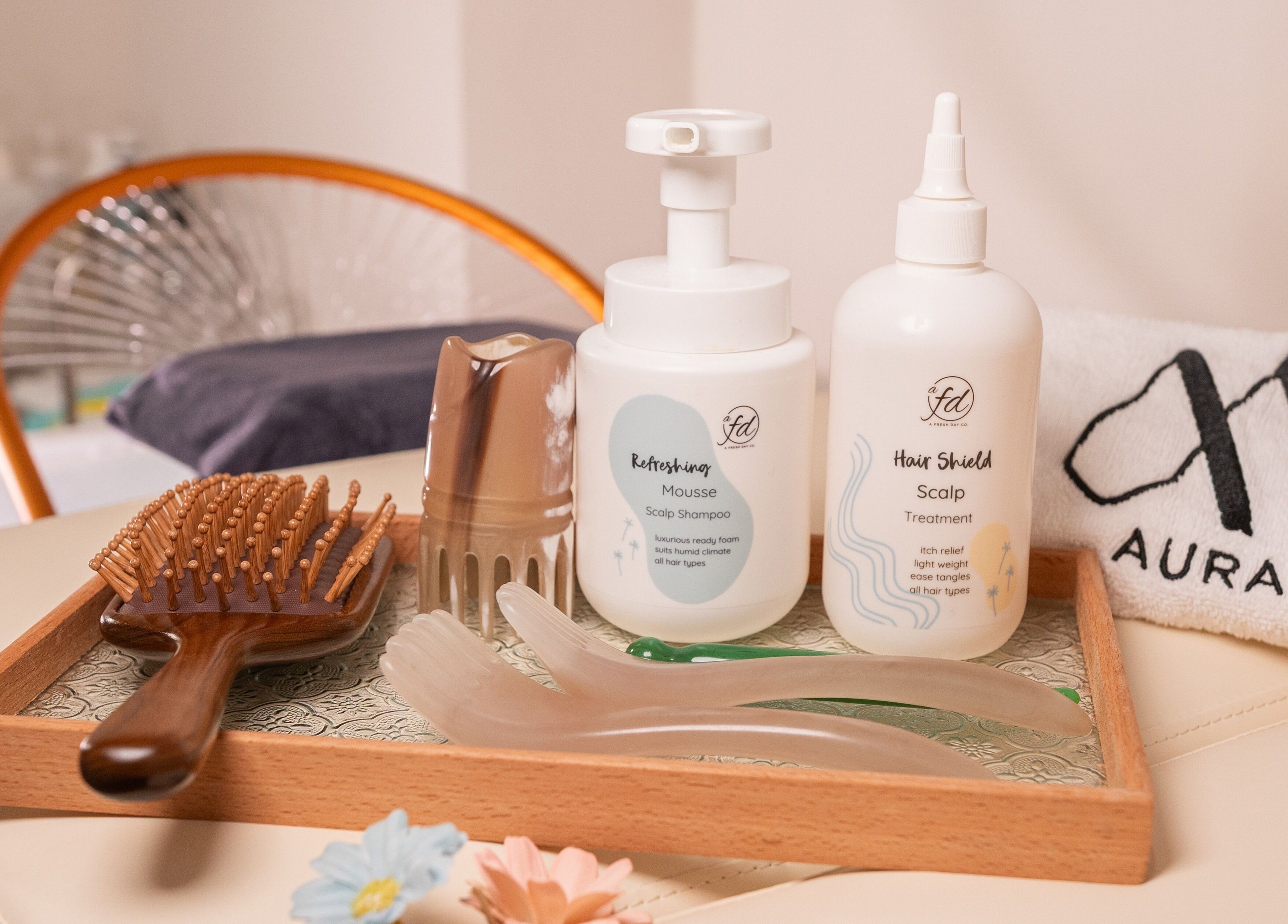 Hair care essentials at AURA Hexacube Studio, Singapore, SG, featuring scalp mousse and treatment.
