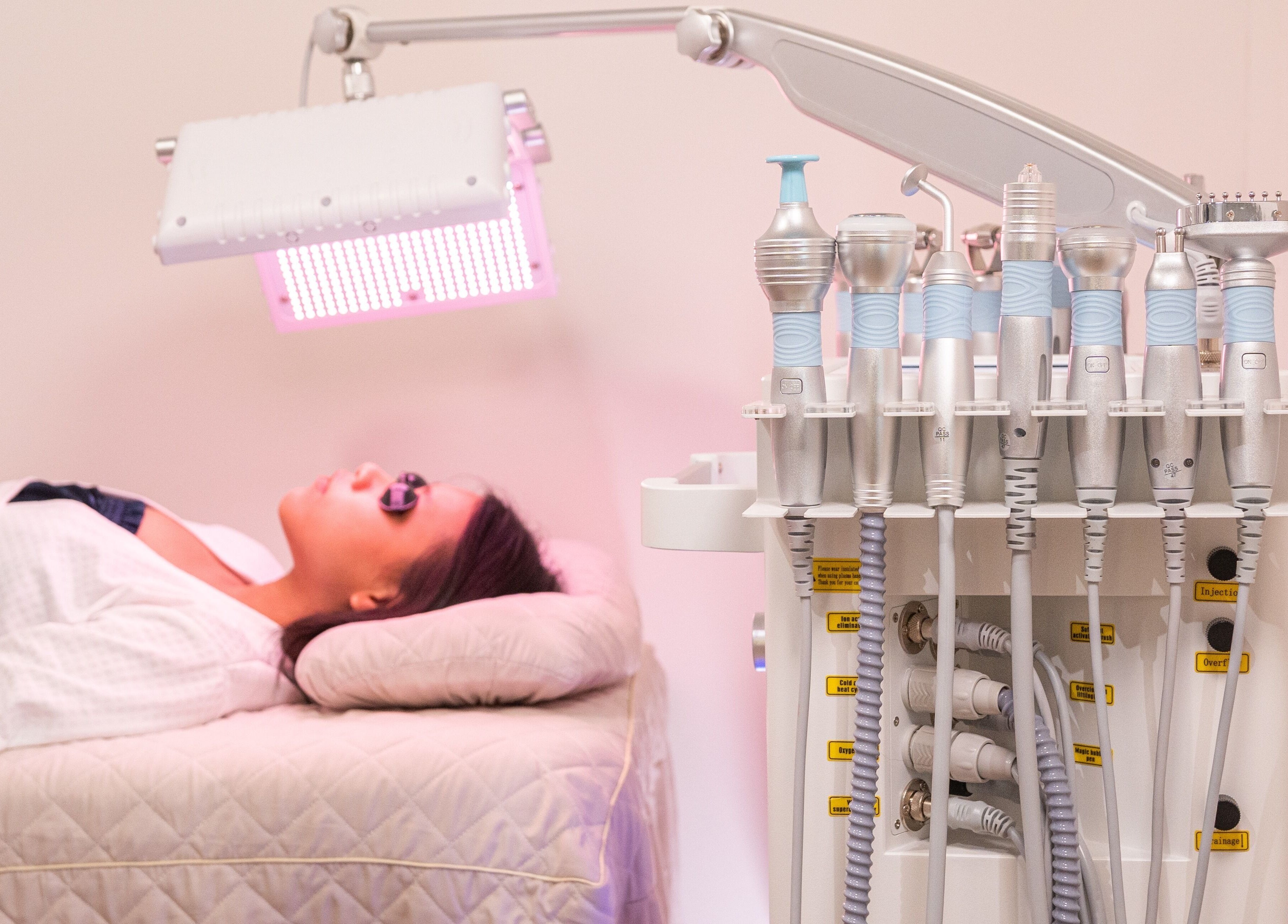 Client receiving advanced facial therapy at AURA Hexacube Studio in Singapore, Singapore, SG.