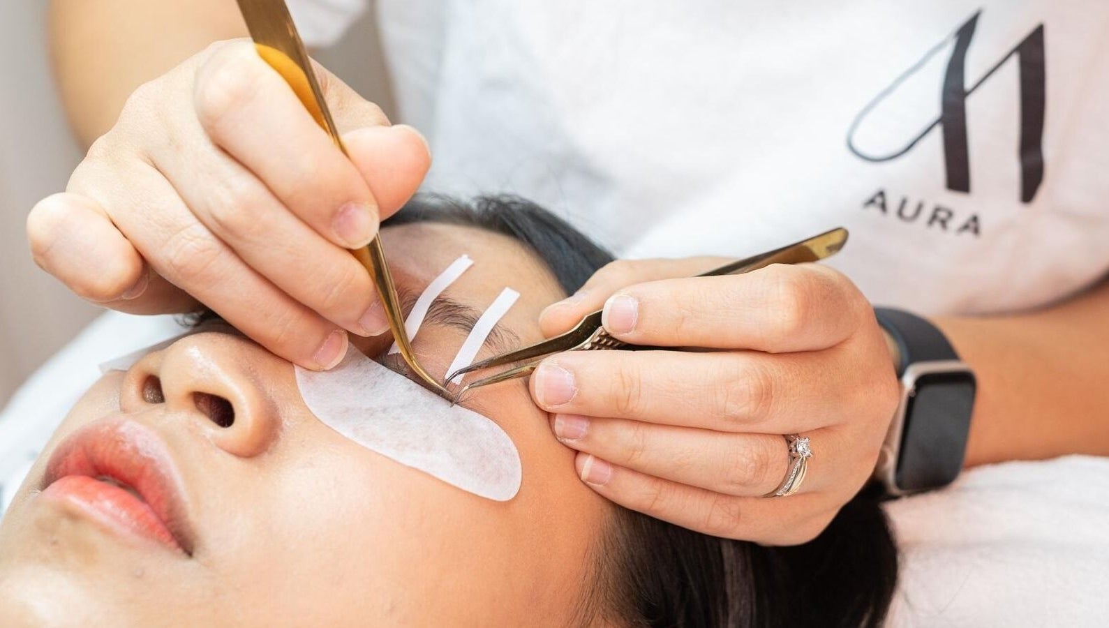 Close-up of eyelash extension application at AURA Woodleigh Studio, Singapore, Singapore, SG.