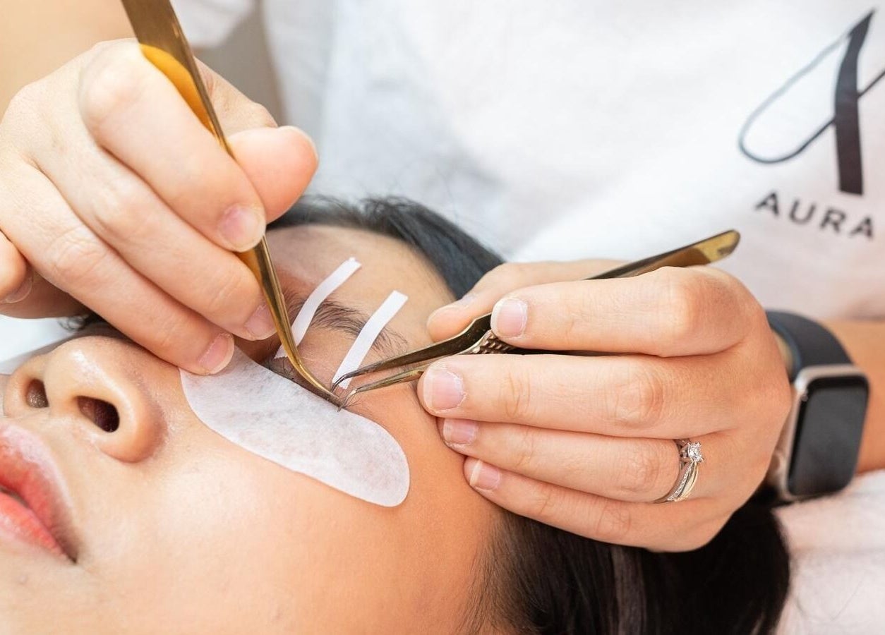 Close-up of eyelash extension application at AURA Woodleigh Studio, Singapore, Singapore, SG.
