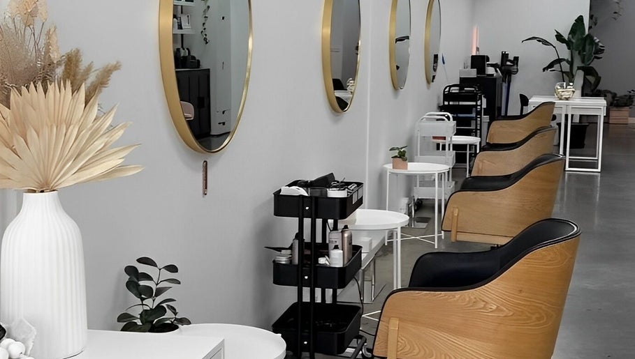 Spacious interior of DDIOR | HAIR | Richmond featuring modern salon chairs and mirrors in Richmond, Victoria, AU.