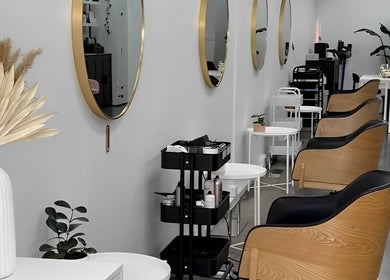 Spacious interior of DDIOR | HAIR | Richmond featuring modern salon chairs and mirrors in Richmond, Victoria, AU.