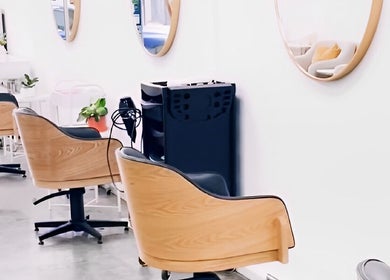 DDIOR | HAIR | Richmond salon interior with sleek chairs and mirrors in Richmond, Victoria, AU.