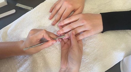 Manicure in progress at Luminous Nails, Everton, Kwazulu-natal, ZA. Close-up of hand care and grooming.