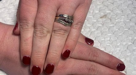 Close-up of elegant deep red nails at Luminous Nails, Everton, Kwazulu-natal, ZA, showcasing trendy manicure.