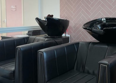 Sleek salon wash stations at The Salon Sanctuary in Liverpool, England, GB showcase modern beauty in black.