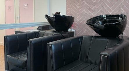 Sleek salon wash stations at The Salon Sanctuary in Liverpool, England, GB showcase modern beauty in black.
