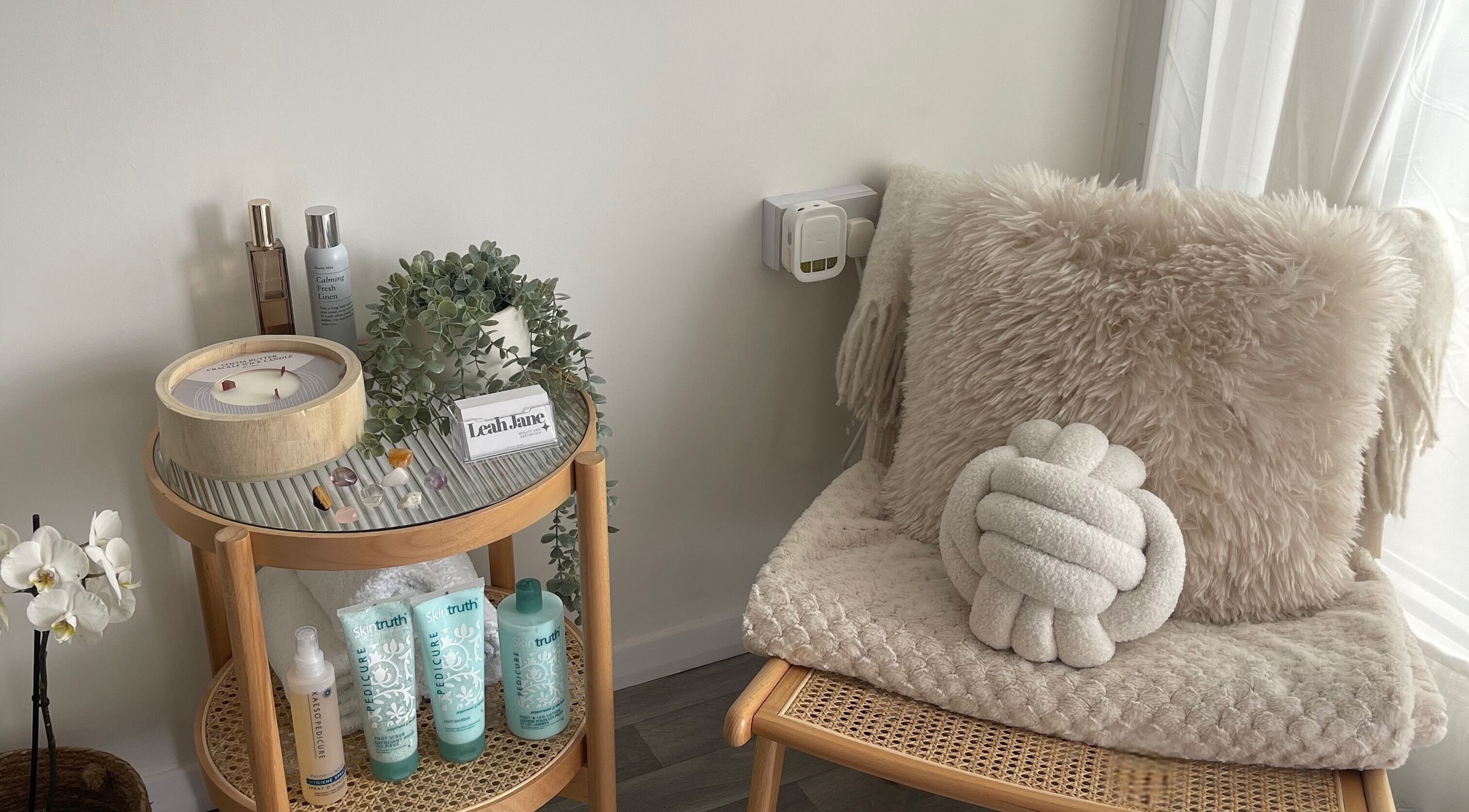 Calm and cozy corner at Leah Jane Beauty and Aesthetics in Rochester, England, GB featuring plush decor and products.