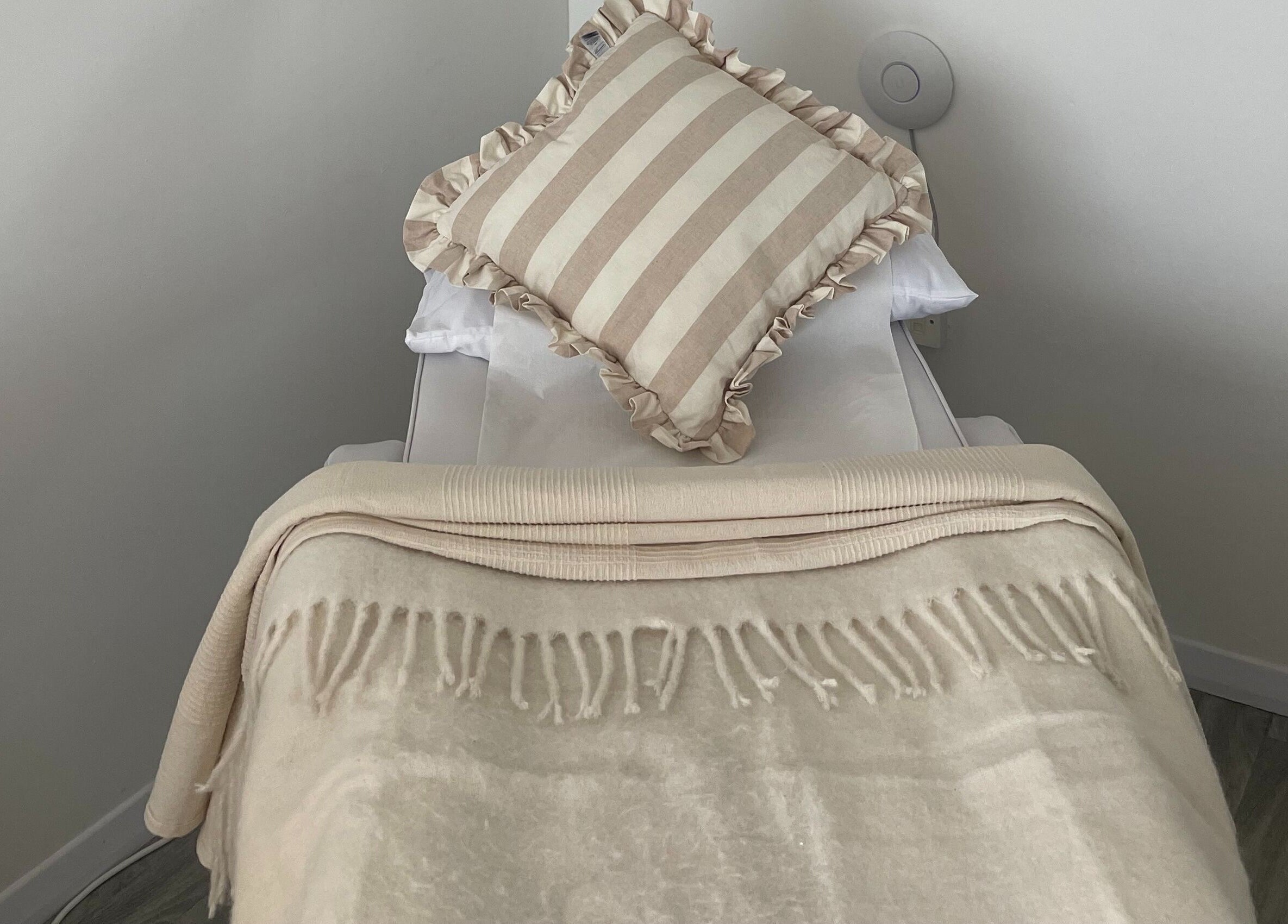 Elegant treatment bed at Leah Jane Beauty and Aesthetics, Rochester, England, GB, ready for relaxation.