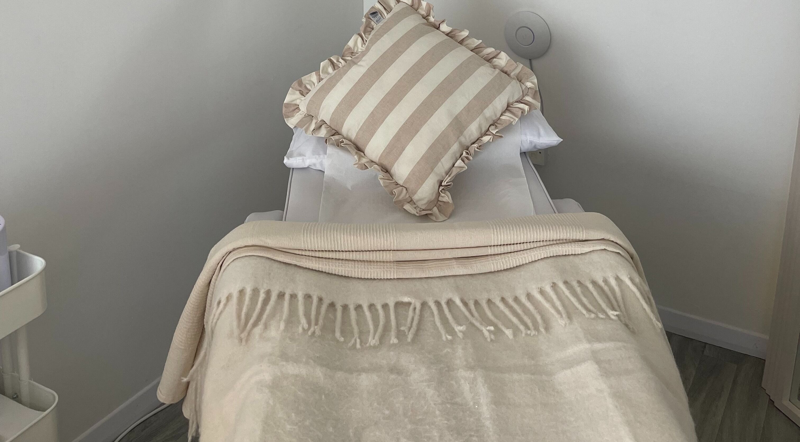 Elegant treatment bed at Leah Jane Beauty and Aesthetics, Rochester, England, GB, ready for relaxation.