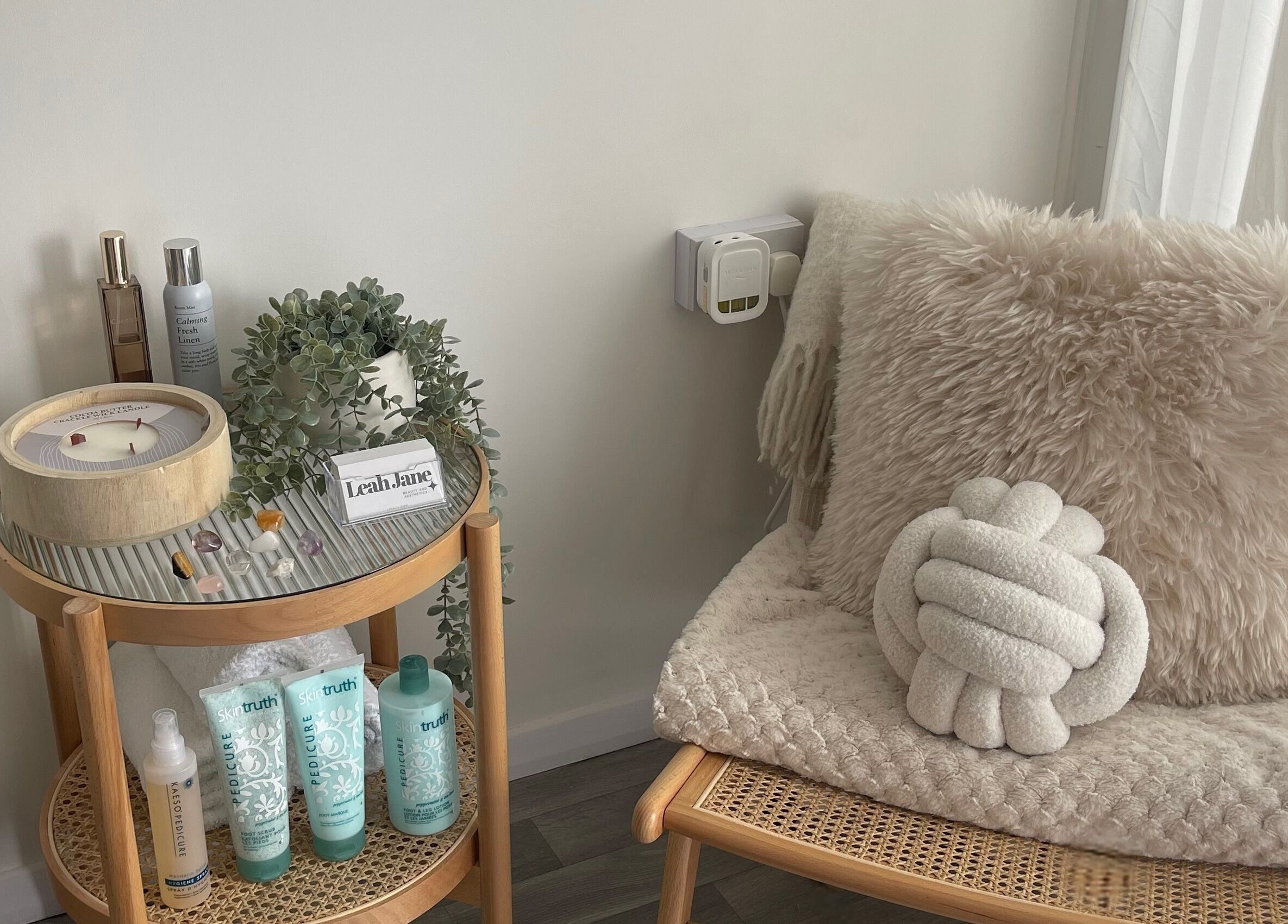 Spa corner at Leah Jane Beauty and Aesthetics in Rochester, England, GB. Elegant decor with skincare products.