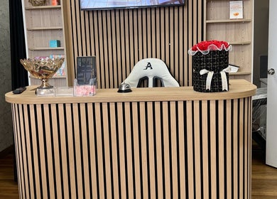 Reception area at OG Lashes Deer Park, Melbourne, Victoria, AU with elegant wooden decor.