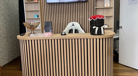 Reception area at OG Lashes Deer Park, Melbourne, Victoria, AU with elegant wooden decor.