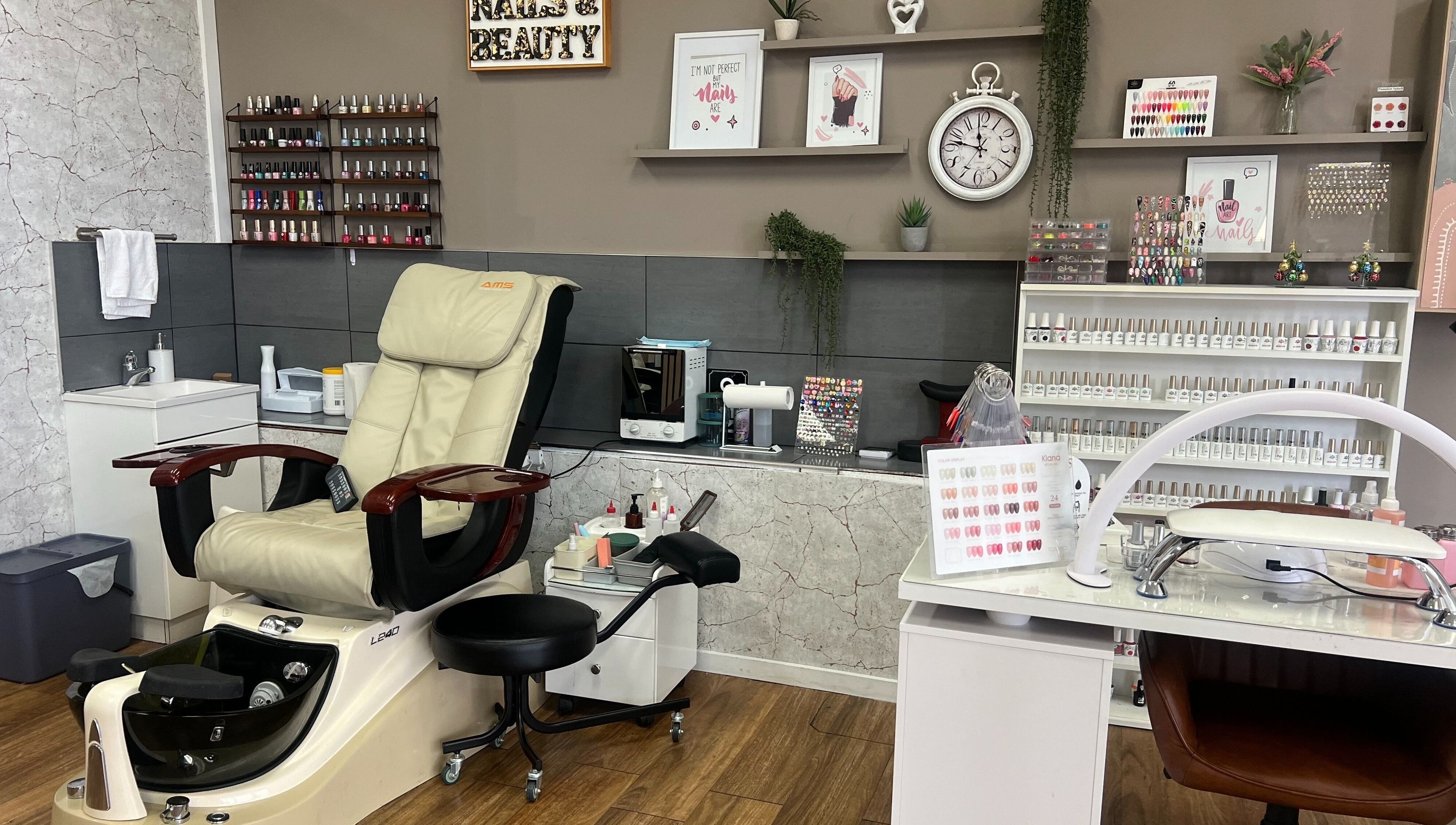 OG Lashes Deer Park nail salon in Melbourne, Victoria, AU with a plush pedicure chair and nail polish display.