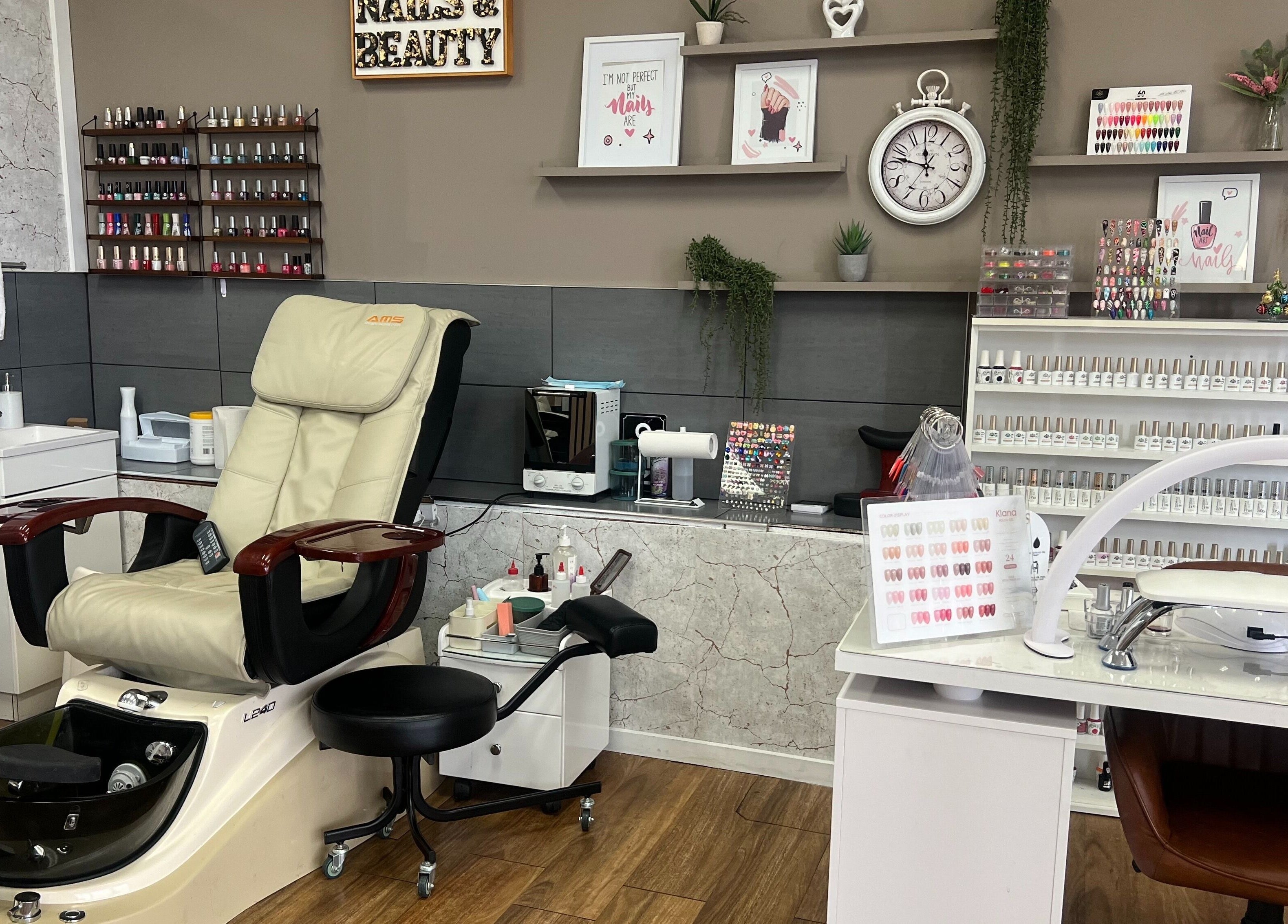 OG Lashes Deer Park nail salon in Melbourne, Victoria, AU with a plush pedicure chair and nail polish display.