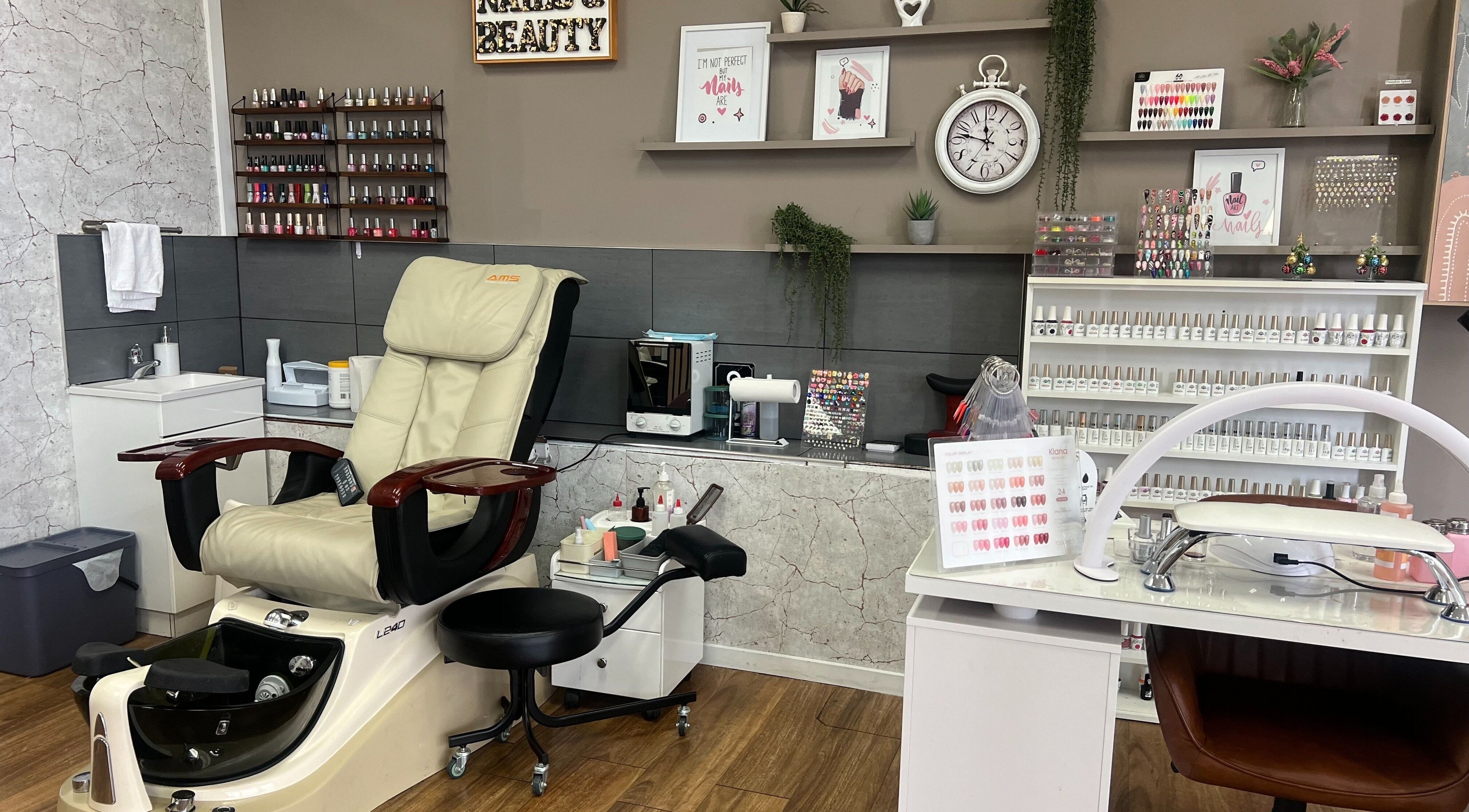 OG Lashes Deer Park nail salon in Melbourne, Victoria, AU with a plush pedicure chair and nail polish display.