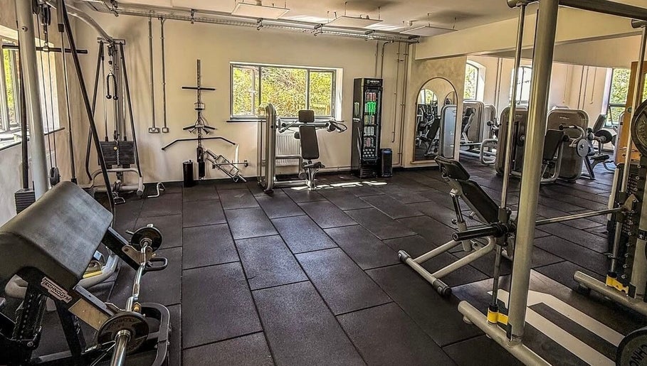 Modern gym at Naomi Clarke PT-The Quarry Health and Fitness, Backwell, England, GB with various workout equipment.