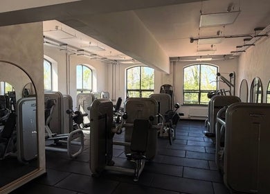 Sunlit gym with fitness machines at Naomi Clarke PT-The Quarry Health and Fitness, Backwell, England, GB.