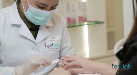 Expert at Feetlab Podiatry L.L.C in Dubai, AE performing nail care service with precision.