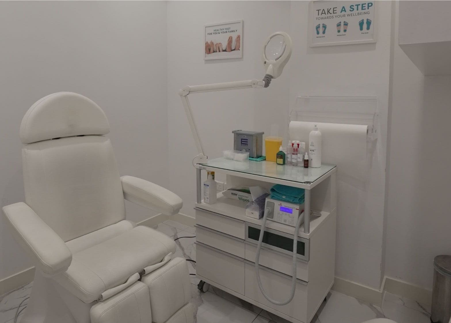 Modern treatment room at Feetlab Podiatry L.L.C - Dubai Hills Mall, Dubai, AE. Features sleek chair and equipment.