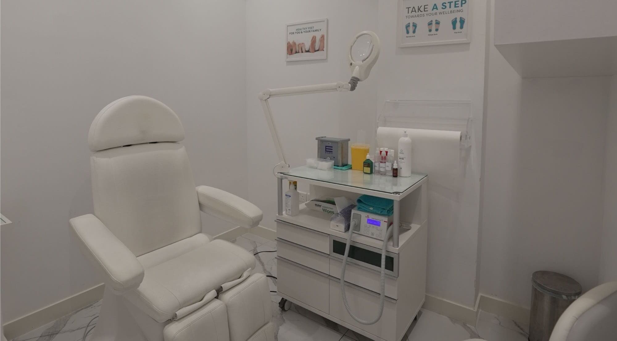 Modern treatment room at Feetlab Podiatry L.L.C - Dubai Hills Mall, Dubai, AE. Features sleek chair and equipment.