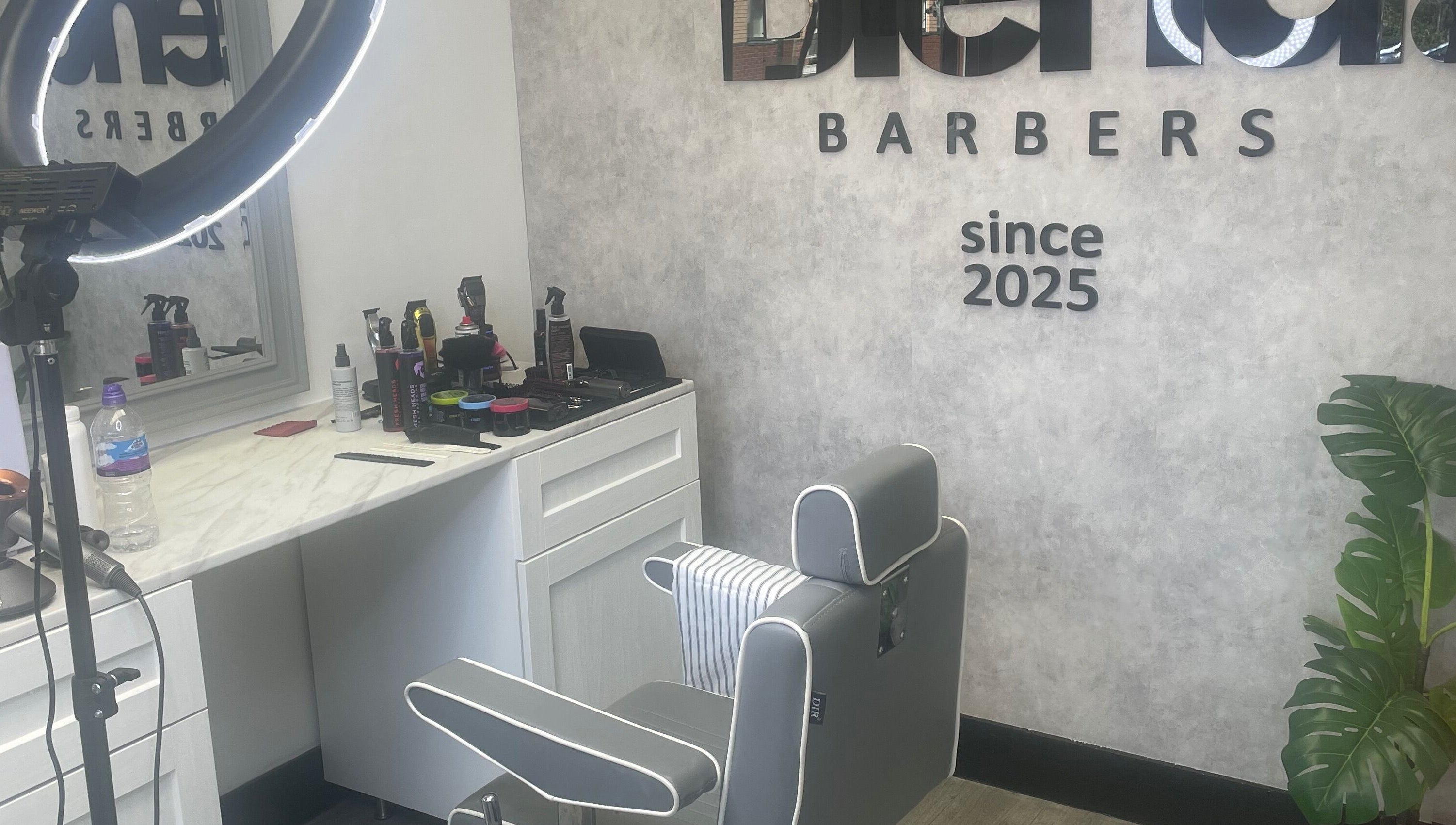 Modern barber chair and styling tools at Blend Barbers, Langdon Hills, England, GB.