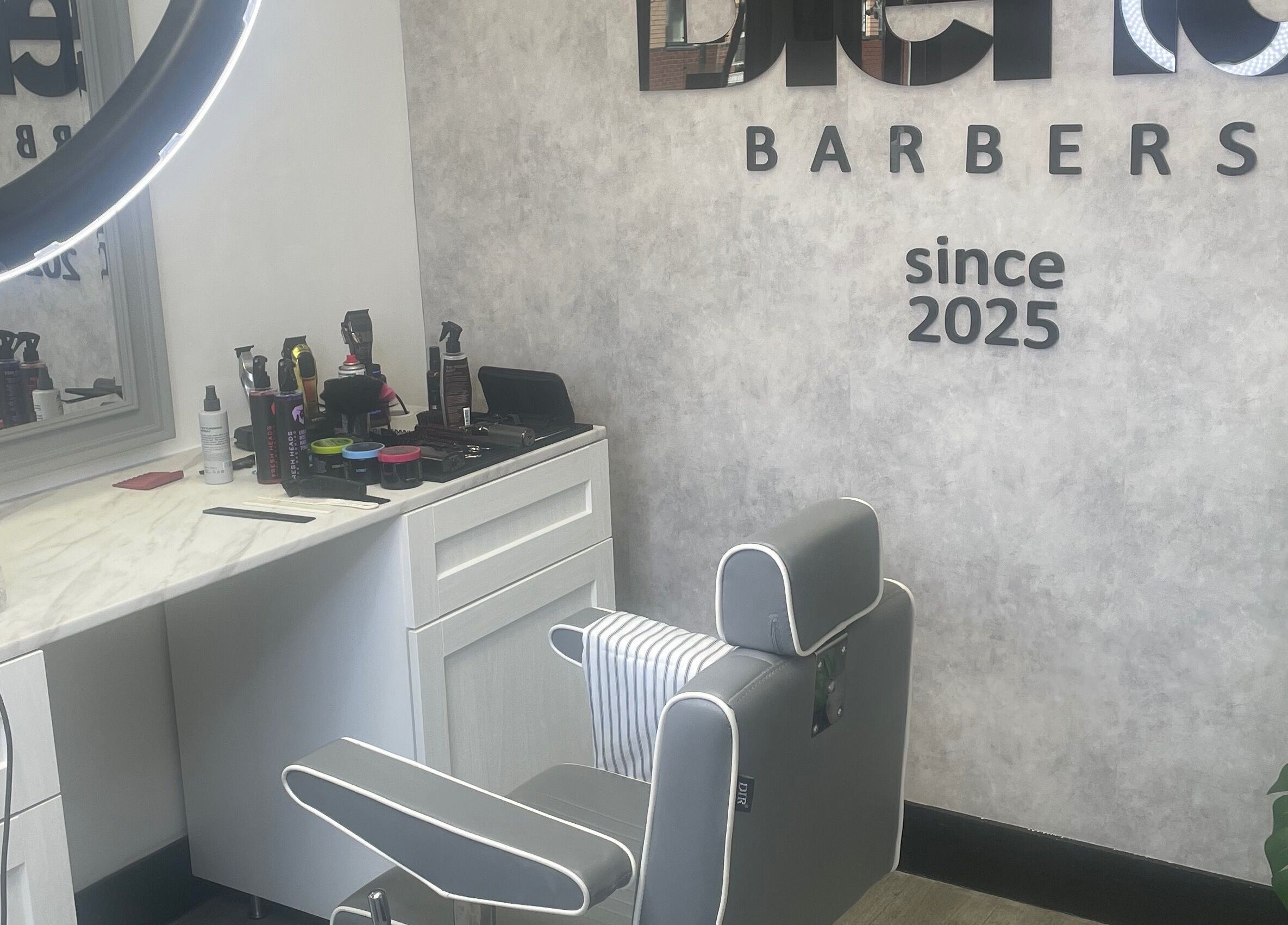 Modern barber chair and styling tools at Blend Barbers, Langdon Hills, England, GB.