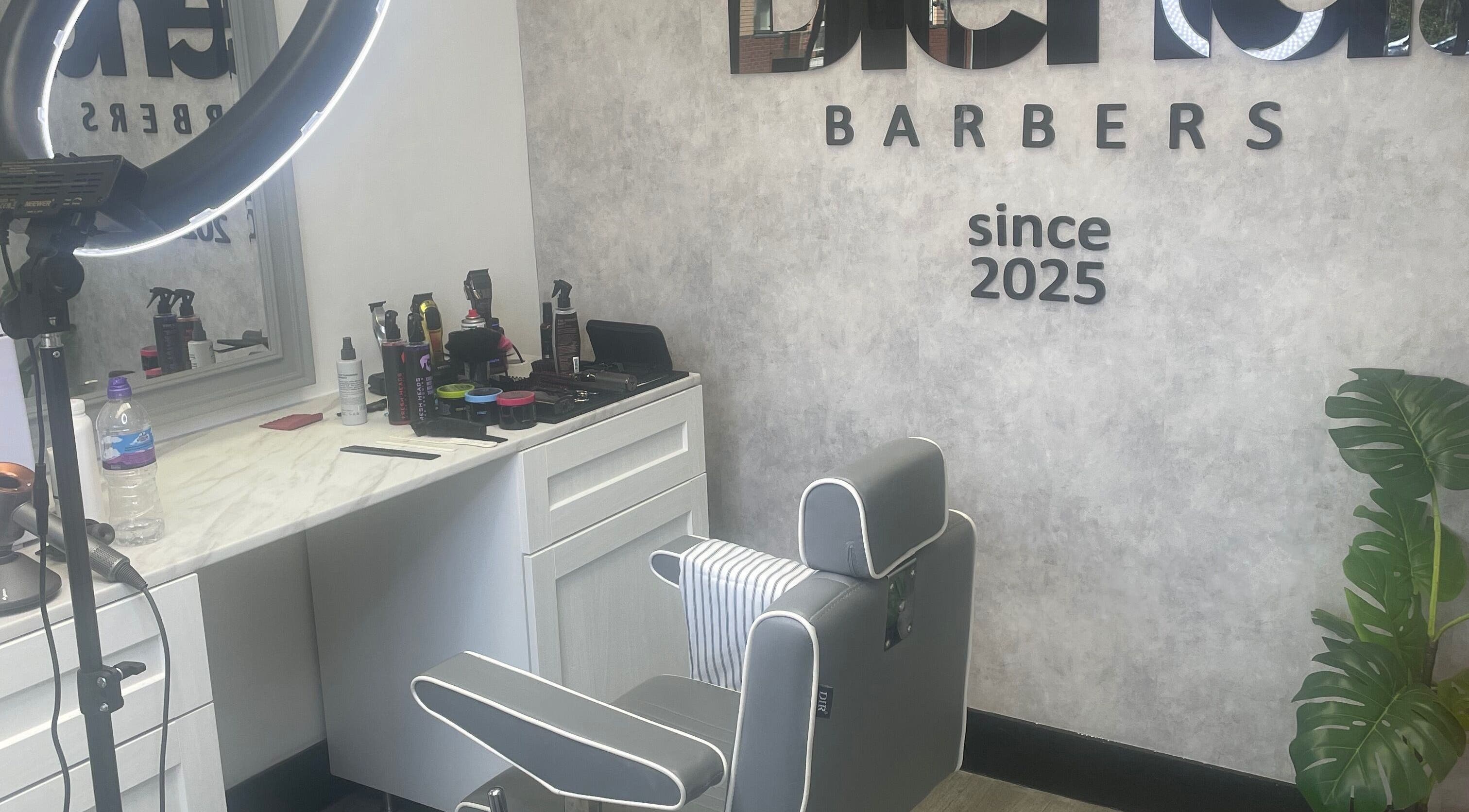 Modern barber chair and styling tools at Blend Barbers, Langdon Hills, England, GB.