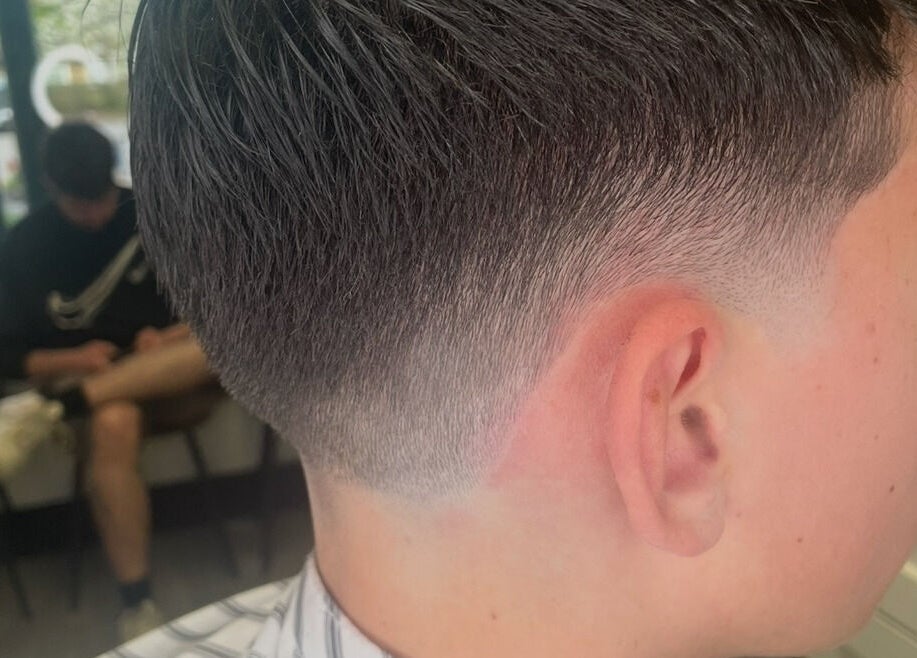 Close-up of a trendy fade haircut at Blend Barbers, Langdon Hills, England, GB.