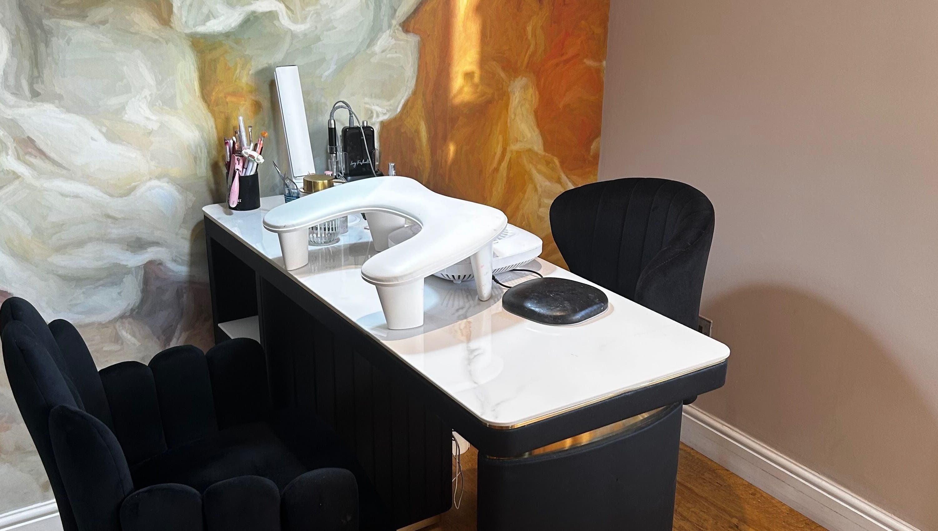 Chic nail station at Sue Does Nails, Long Eaton, NG10 3RJ, England, GB with stylish chairs and artistic decor.