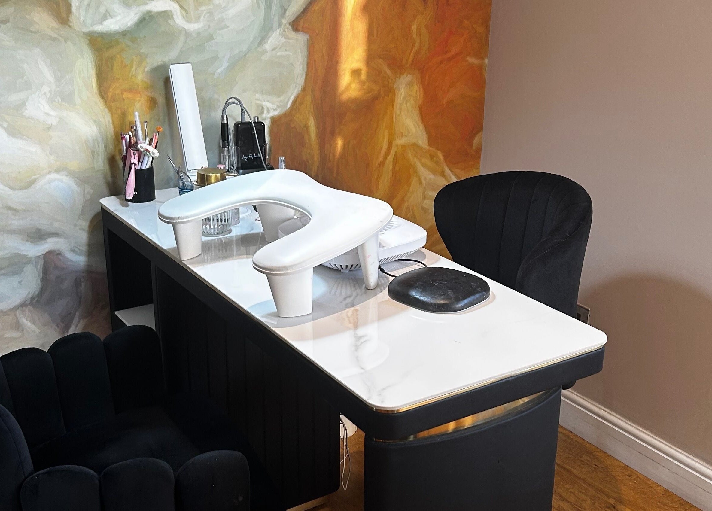Chic nail station at Sue Does Nails, Long Eaton, NG10 3RJ, England, GB with stylish chairs and artistic decor.