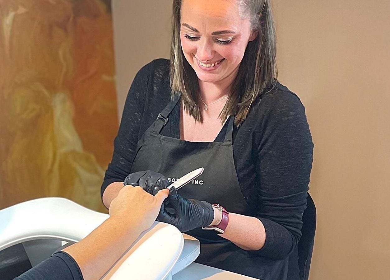 Nail technician at Sue Does Nails, Long Eaton, NG10 3RJ, England, providing expert manicure services.