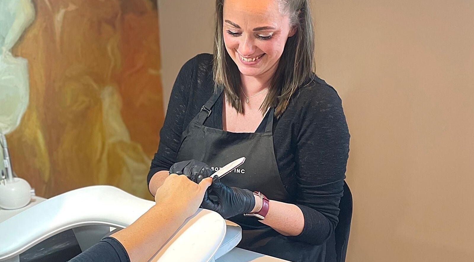 Nail technician at Sue Does Nails, Long Eaton, NG10 3RJ, England, providing expert manicure services.