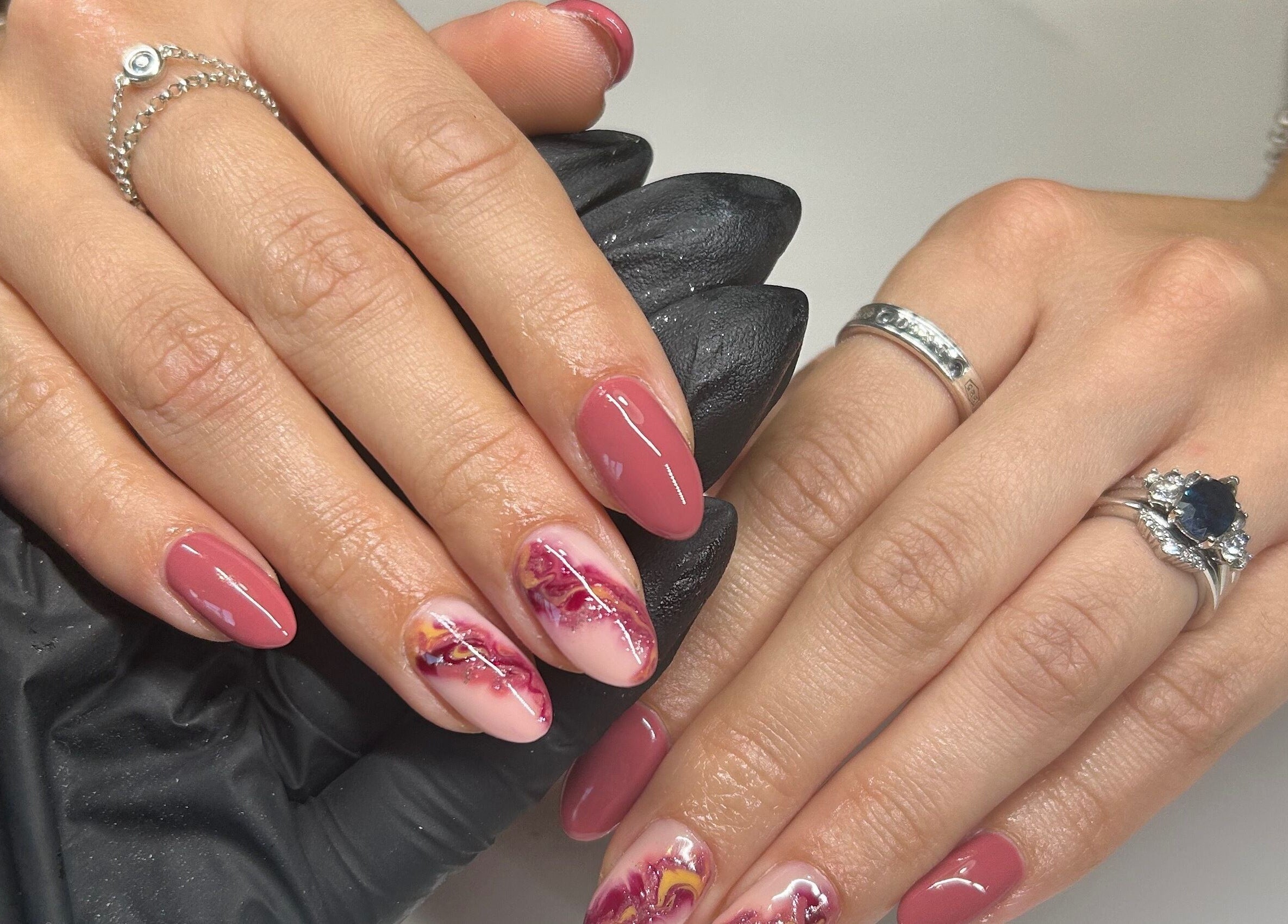 Stunning nail art at Sue Does Nails, Long Eaton, NG10 3RJ, England, GB, featuring intricate pink designs.