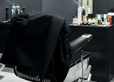 Stylish barber chair in Culture Barbershop, Mandalay, MM, showcasing a modern grooming setup.