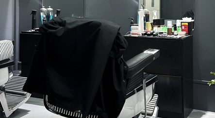 Stylish barber chair in Culture Barbershop, Mandalay, MM, showcasing a modern grooming setup.