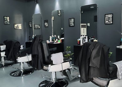 Sleek interior of Culture Barbershop in Mandalay, MM showcasing stylish barber chairs and modern decor.