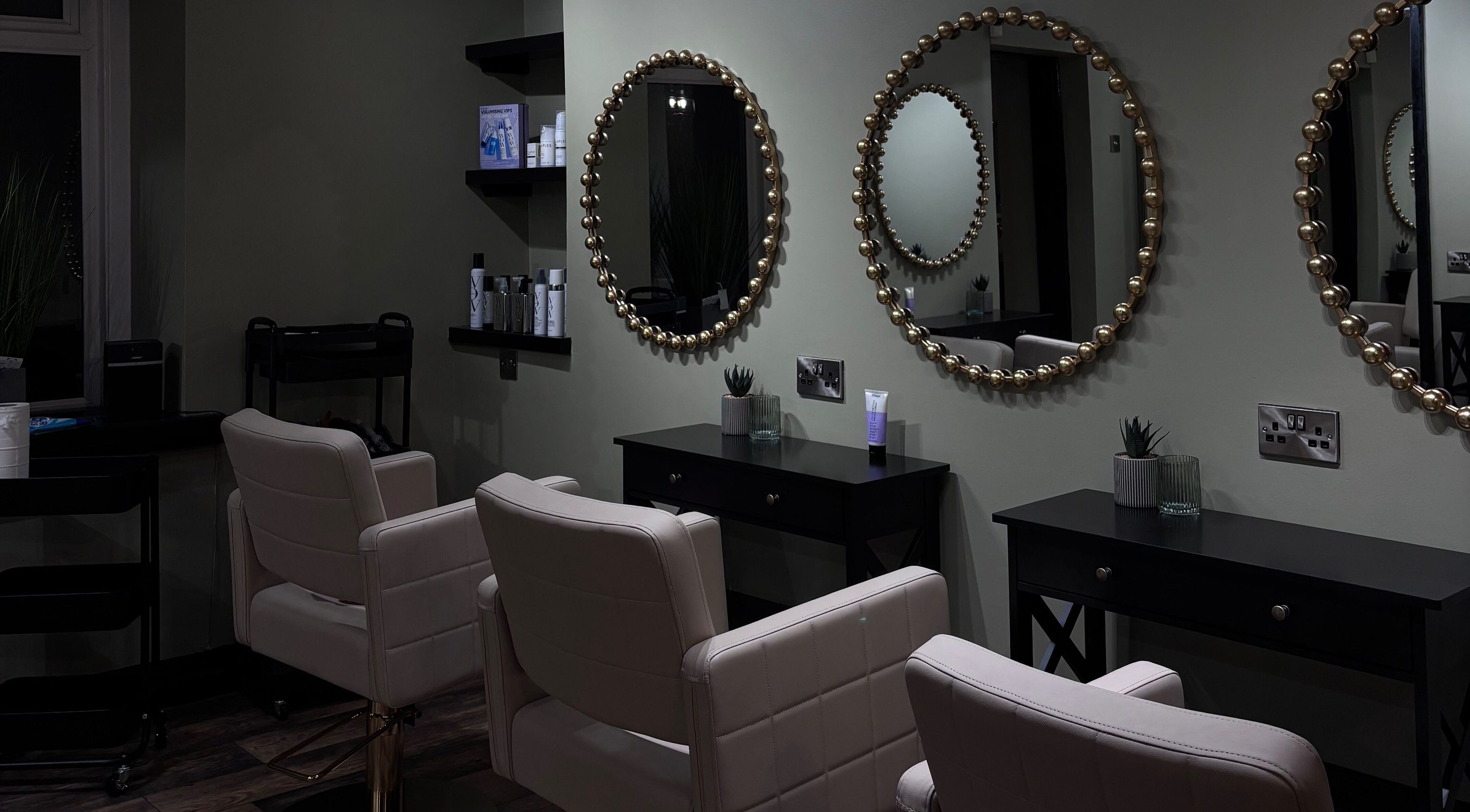 Luxury salon chairs and ornate mirrors at Another Salon, Swansea, GB, offering elegant beauty services.