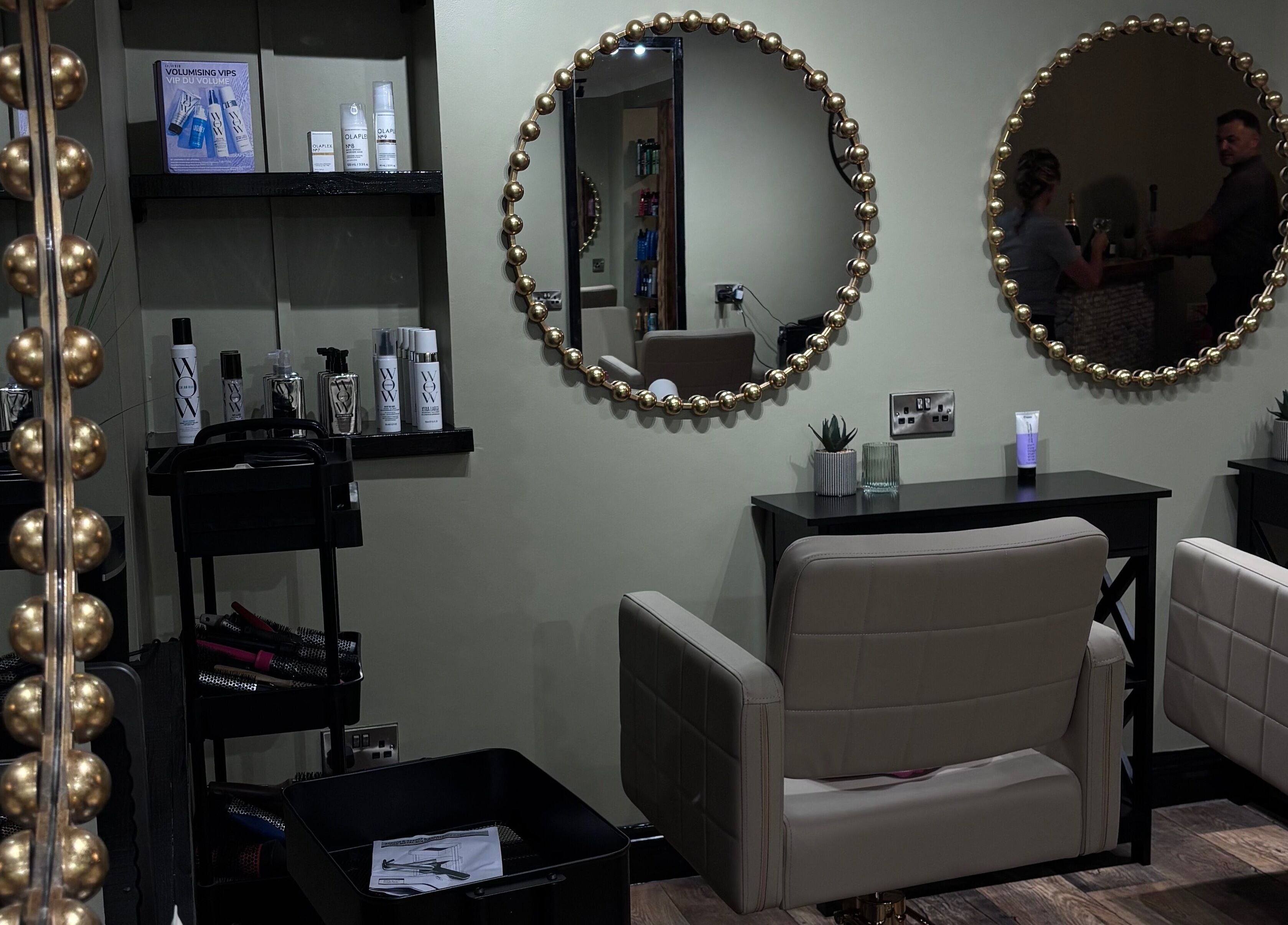 Elegant salon mirrors and styling chairs at Another Salon in Swansea, GB, showcasing top-tier beauty products.