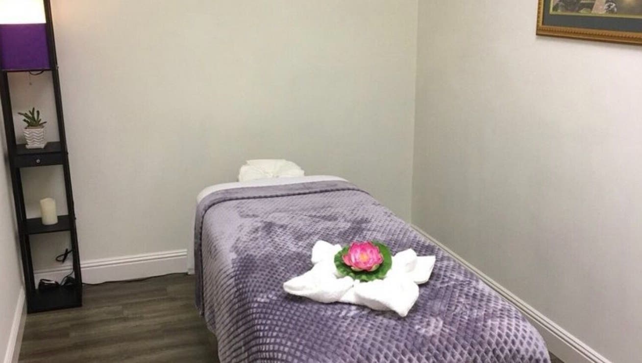 Cozy massage room at Canoga Park Massage, Los Angeles, California, US, with a plush table and calming decor.