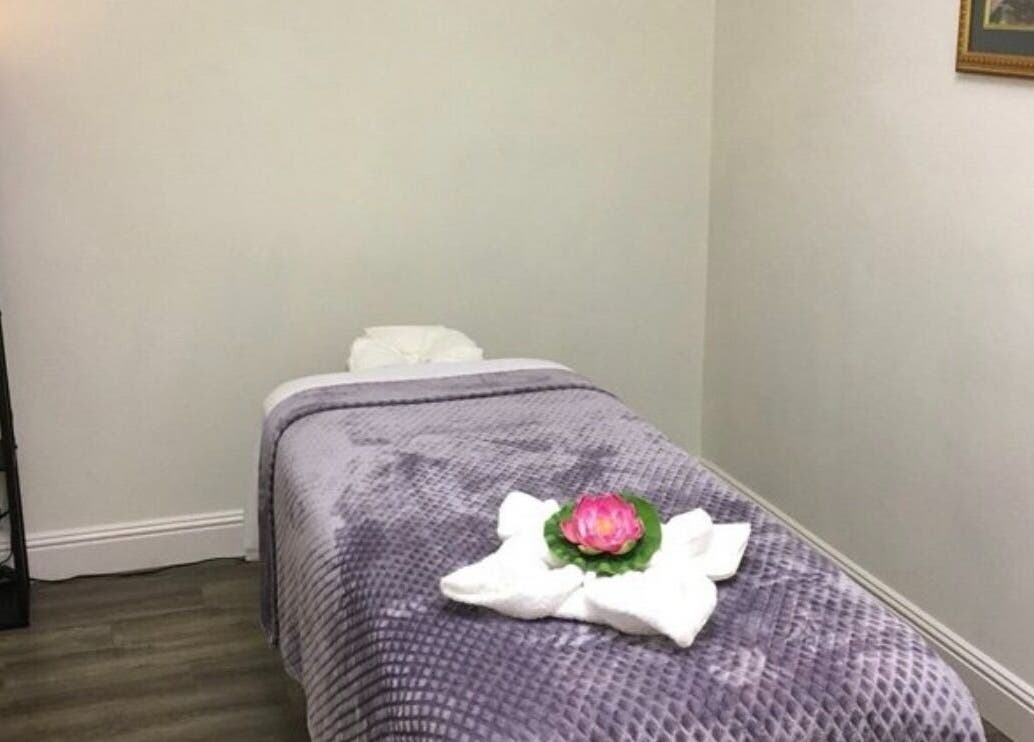 Cozy massage room at Canoga Park Massage, Los Angeles, California, US, with a plush table and calming decor.