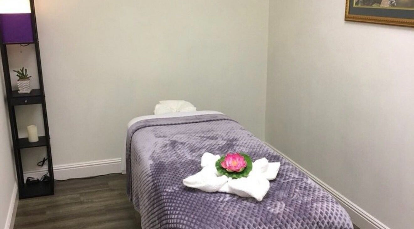 Cozy massage room at Canoga Park Massage, Los Angeles, California, US, with a plush table and calming decor.
