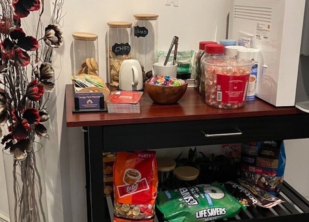 Snack station at Canoga Park Massage, Los Angeles, California, US offering a variety of refreshments.